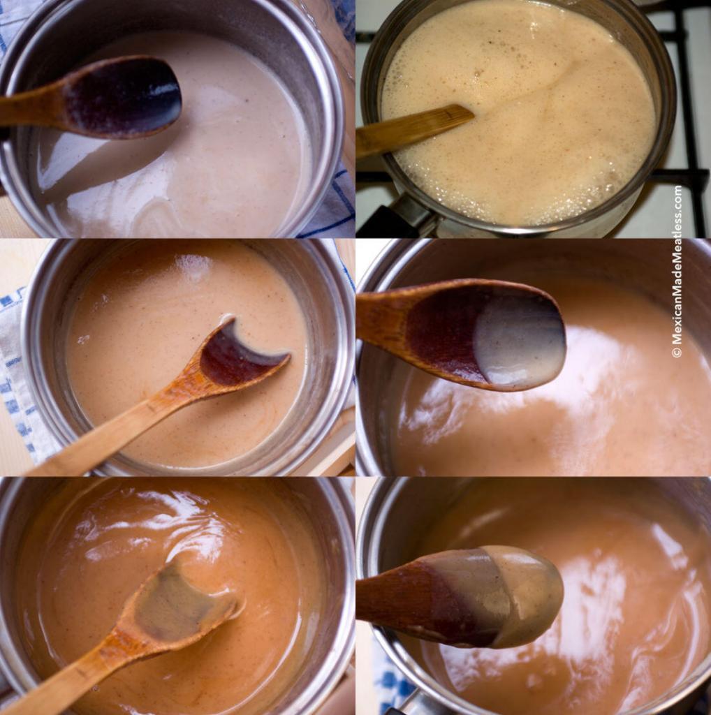 Cooking cajeta or Mexican milk caramel sauce inside a stainless steel pot and with a wooden spoon. 