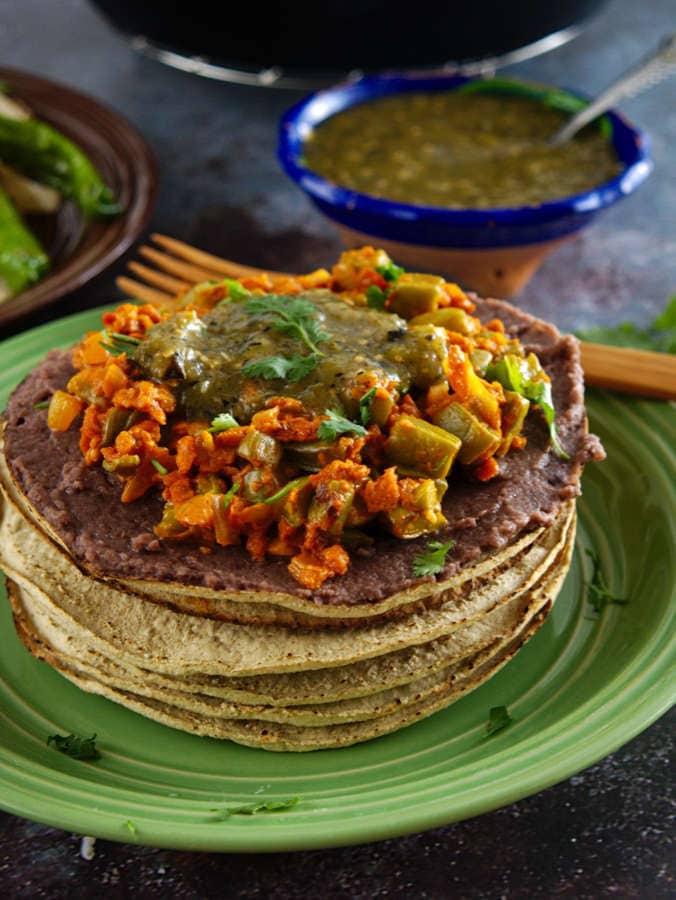 Tostadas with refried beans and sauteed nopales with soyrizo. A scrumptious vegan meal! 
