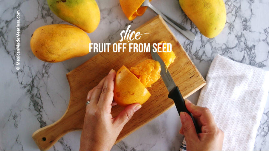 How to slice the fruit flesh off of a mango seed. 