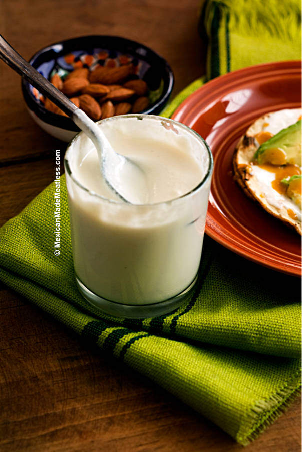 A short glass filled with Mexican crema vegana made from ground almonds. 