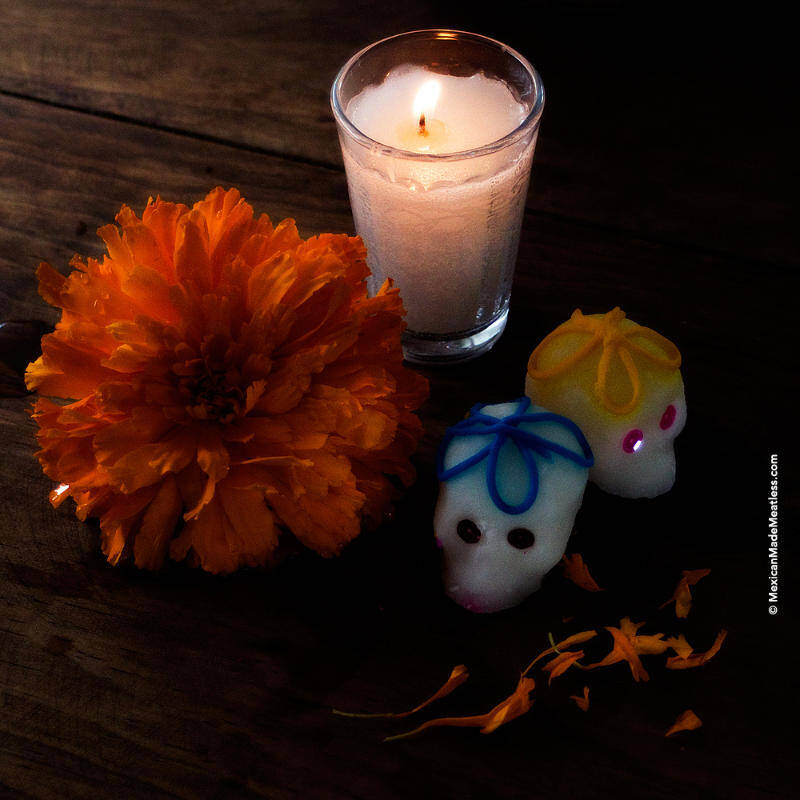Marigold, sugar skulls and candles are part of the Day of The Dead altar elements.