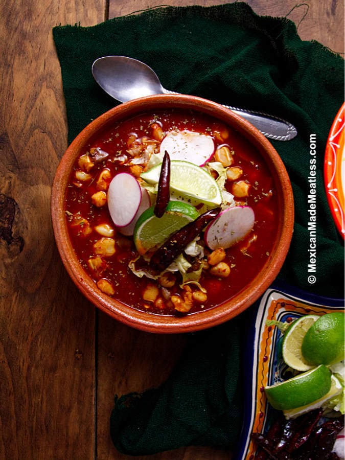 A bowl of vegan pozole rojo, check out the easy recipe!