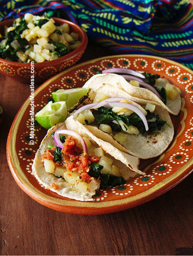 Mexican plate with 3 vegan soft potato tacos with spinach.