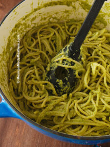 Mexican green spaghetti or espagueti verde inside a large blue and white pot.