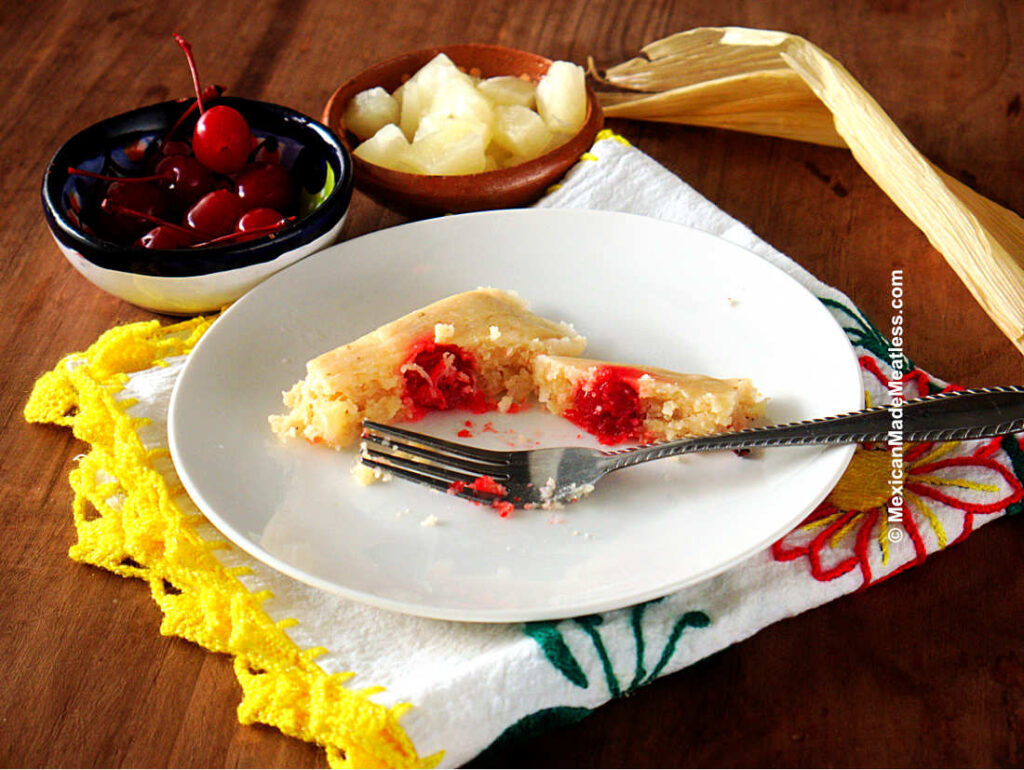 One sweet pineapple or piña tamale with a cherry in the center