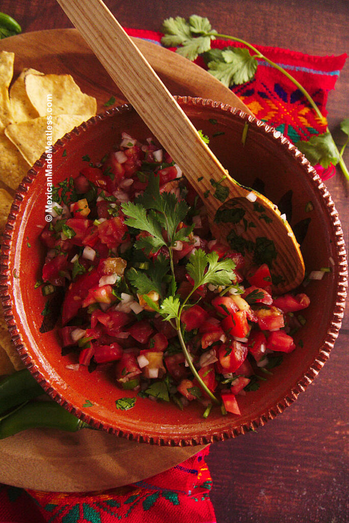 A big bowl of raw salsa or tomato salsa fresca.
