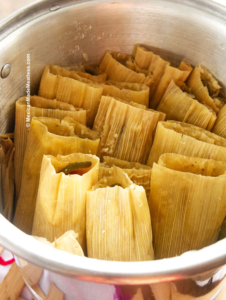 Steamed Cooked Tamales on The Stove and In a Steamer Pot.