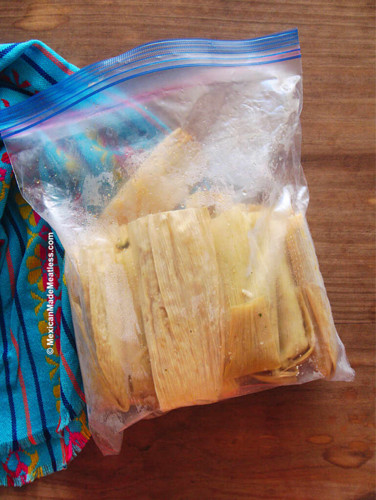 Cooked tamales inside a plastic bag ready to be stored in the fridge.