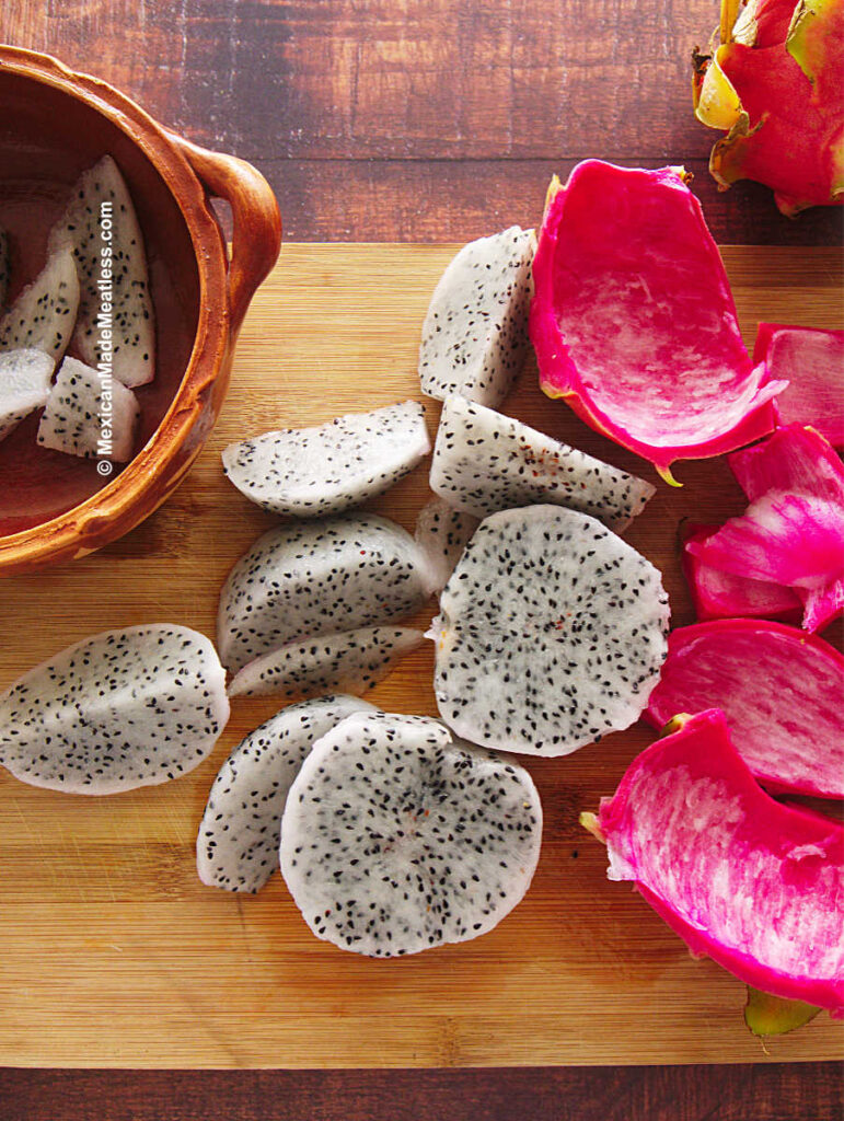 Showing how to peel dragon fruit without a knife and with a spoon.