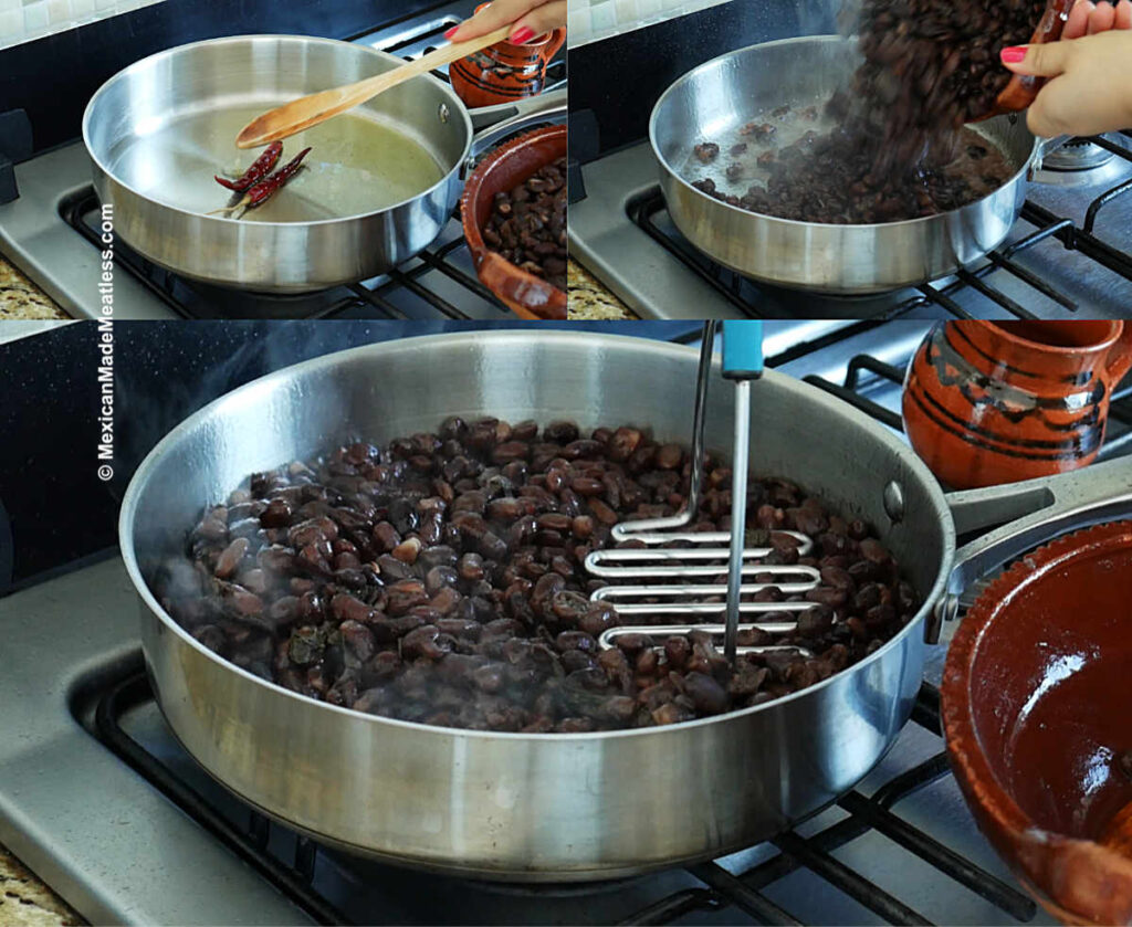 Mashing cooked black beans in a large frying pan with hot oil to make Mexican refried beans. 