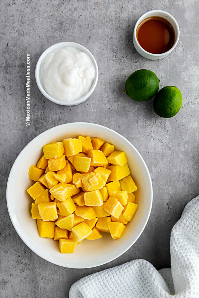 Ingredients for Mexican mango paletas: mango, coconut cream, agave and limes.