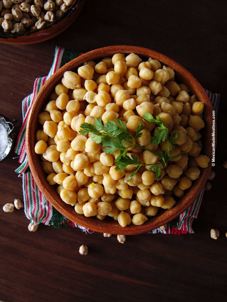 Cooked chickpeas inside a small bowl.