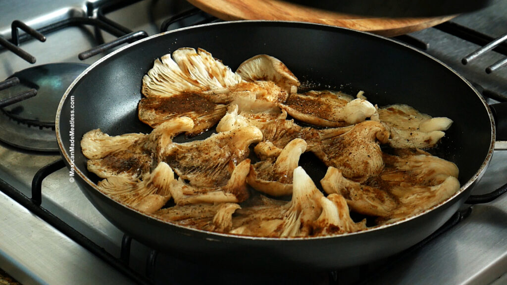 Seasoned mushrooms cooking to make vegan steak tacos.