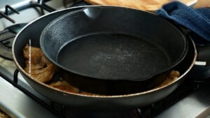 Cast iron skillet used to flatten mushrooms for tacos.