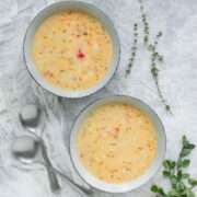 Two bowls filled with smoky Hatch chile corn chowder.