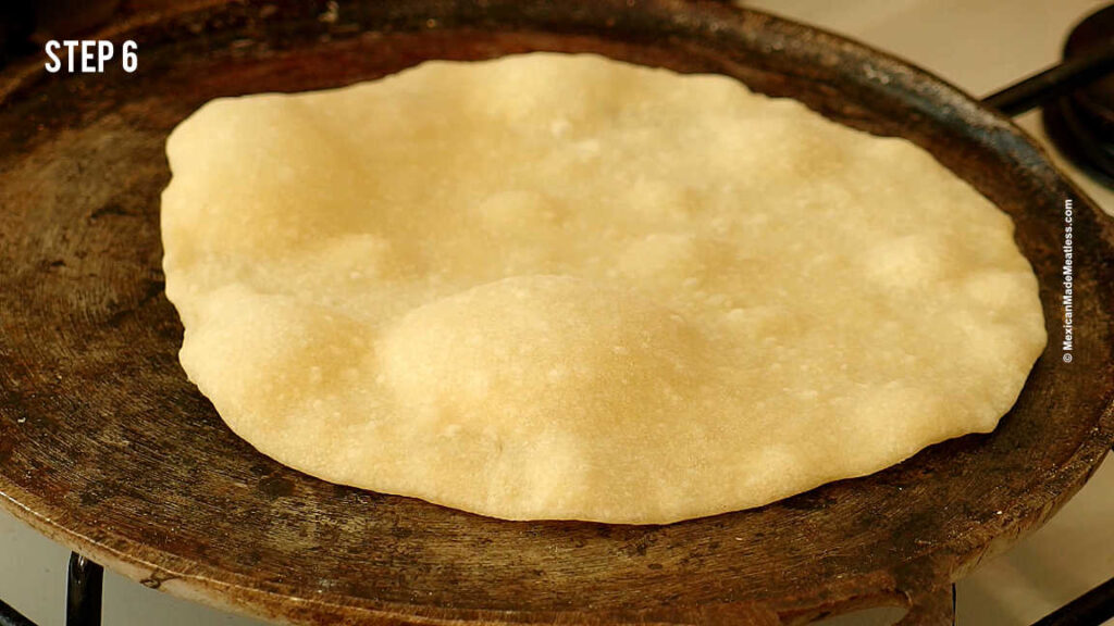 Cooking flour tortillas on a skillet.