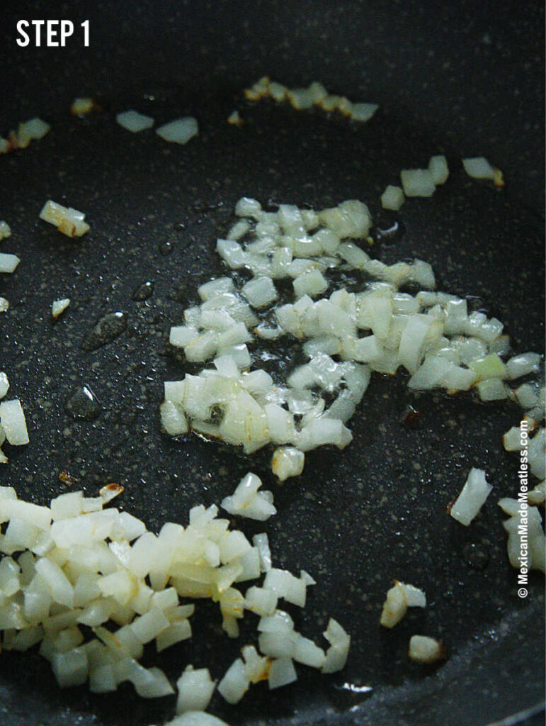 Sautéing white onion to make Mexican potatoes and eggs. 