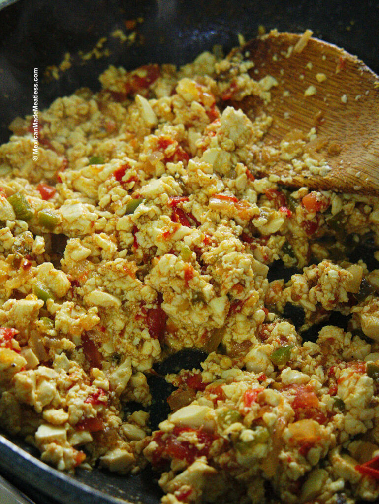 Cooked Mexican style scrambled eggs with a vegan tofu twist.