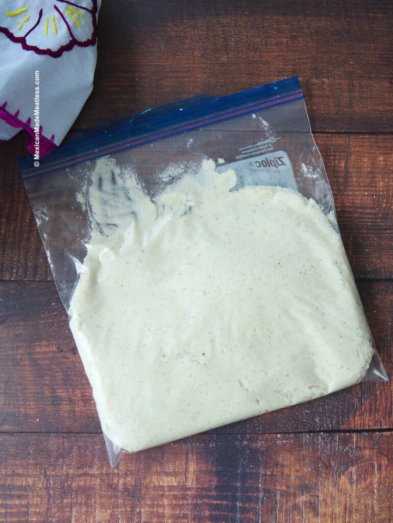 Ziploc bag filled with leftover tamale masa dough ready to be frozen. 