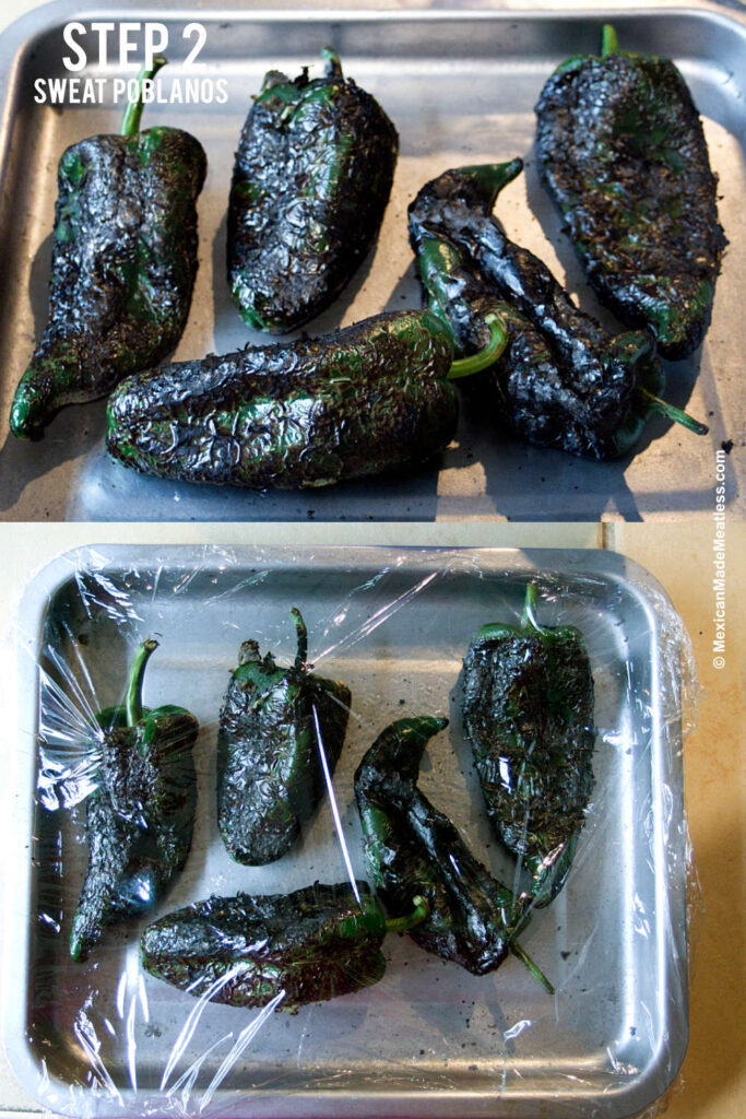 A small baking sheet with 6 fire roasted poblano peppers on it. 