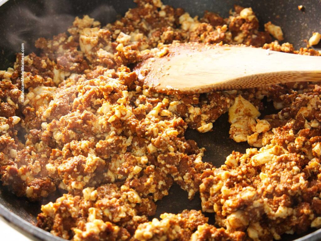 View inside a skillet filled with vegan chorizo and scrambled tofu egg,