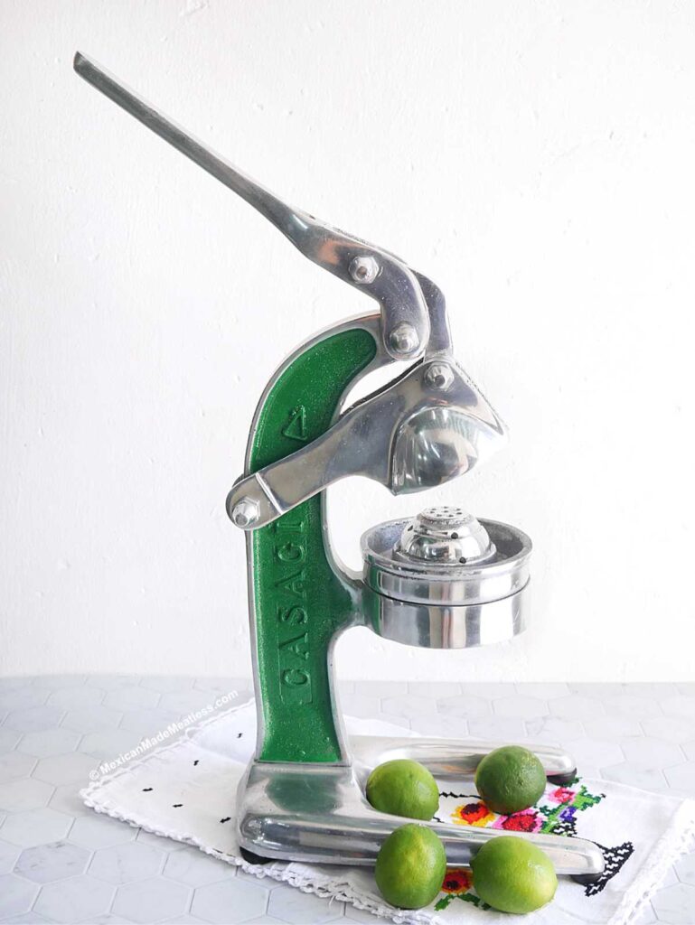 A Mexican standing citrus juicer on top of a kitchen countertop.